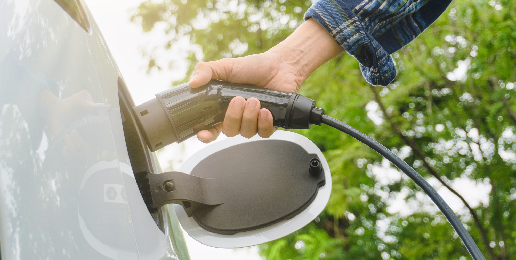 Electric car or ev is charging at station.