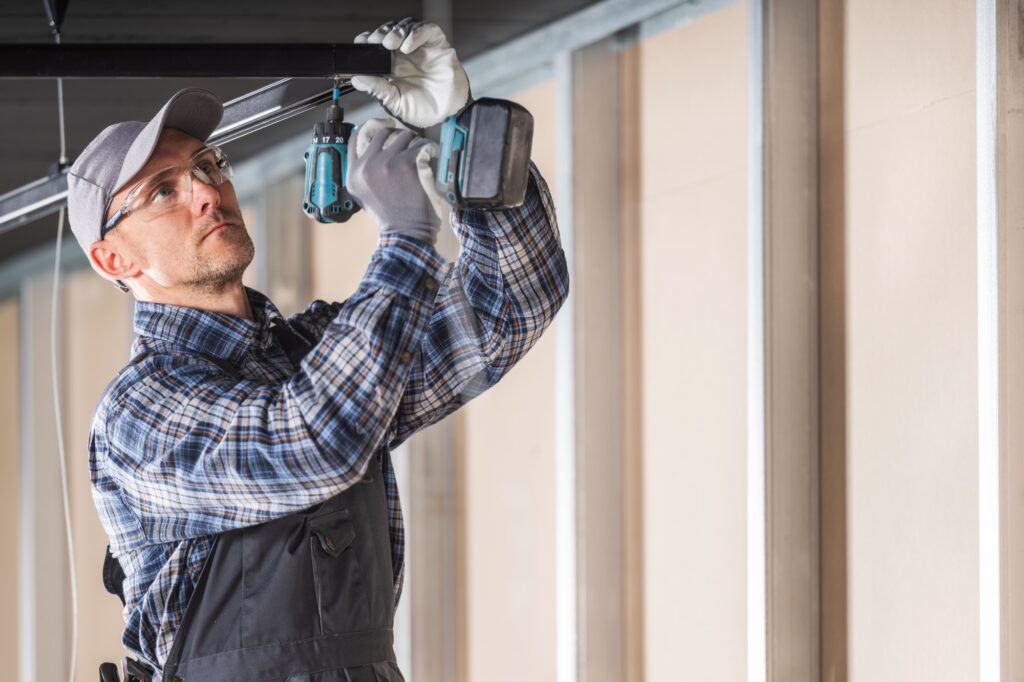 Electrician Installing Suspended Lighting Elements