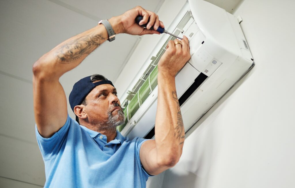 Maintenance, ac repair and air conditioner with man and screwdriver for electrician, ventilation an